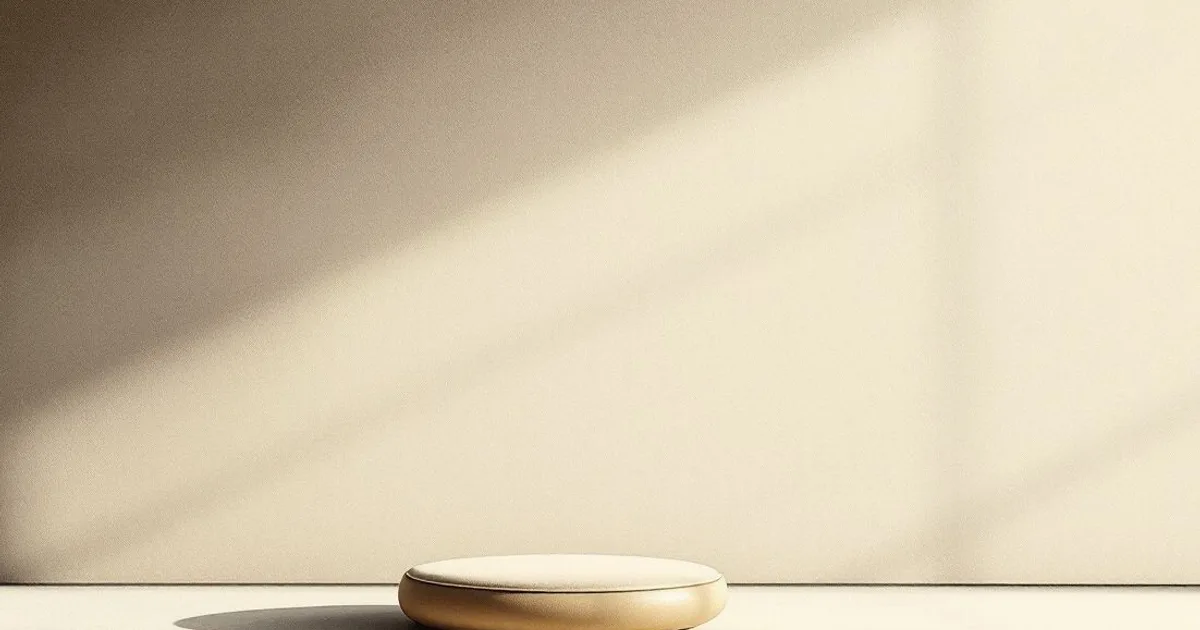 Sumi-e ink-wash illustration: an empty upright meditation cushion in a quiet, bare room.